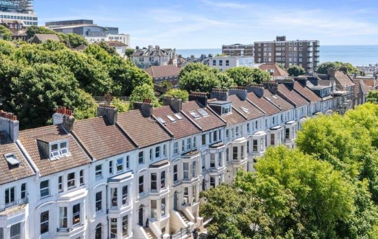 Terraced homes by the sea, blue sky