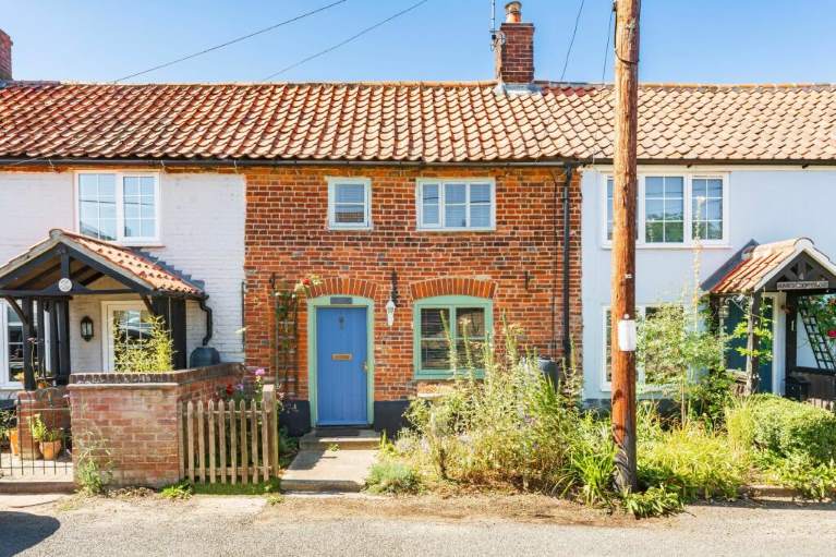 A row of terraced cottages, blue sky